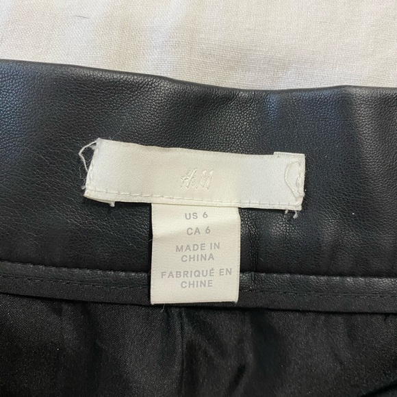 Black pleather, snap front mini skirt. - Picture 3 of 3